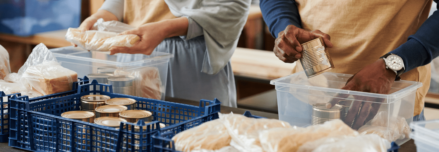 Not for Profit Packing food into Bins | Rea & Associates