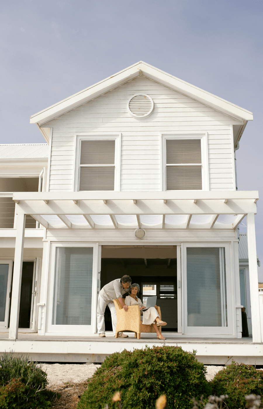 Retired Pair on Porch of Beach House